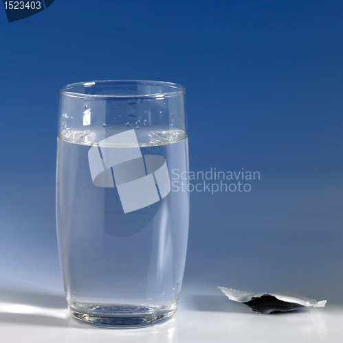 Image of glass of water in blue back