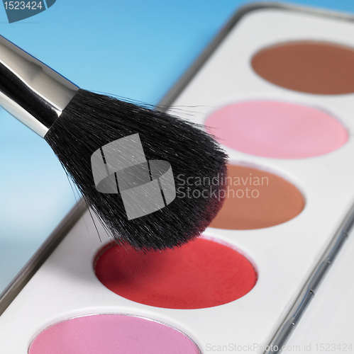 Image of make-up colors and brush