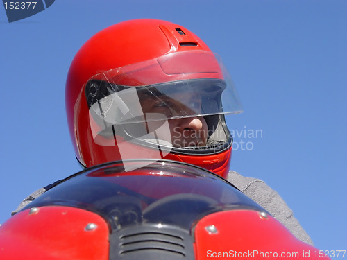 Image of Man on a red bike