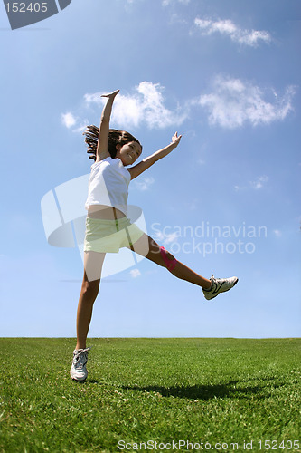 Image of Happy girl on grass