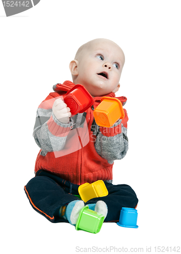 Image of little boy with a plastic pyramid in the studio