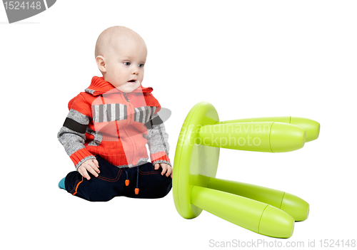 Image of child dropped a plastic chair in the studio