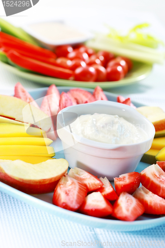 Image of Raw  fruits and vegetables with dip