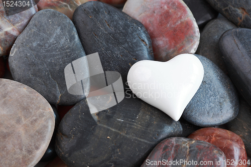 Image of White heart surrounded by stones