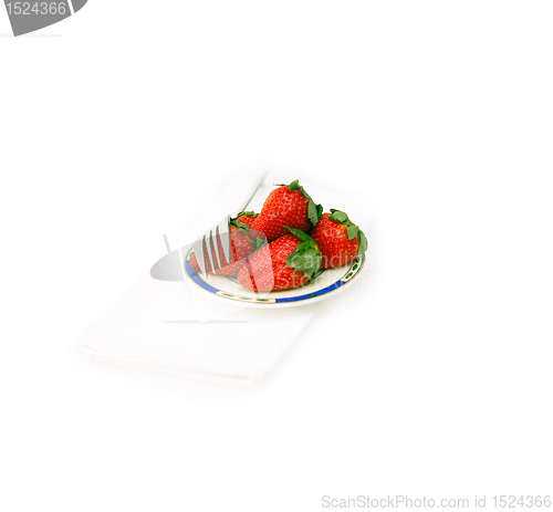 Image of fresh strawberries dish over white