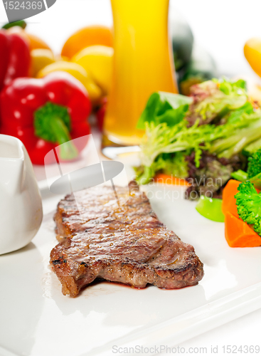 Image of juicy BBQ grilled rib eye ,ribeye steak and vegetables