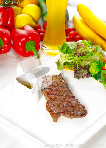 Image of juicy BBQ grilled rib eye ,ribeye steak and vegetables