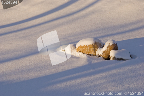 Image of Stones covered with snow.