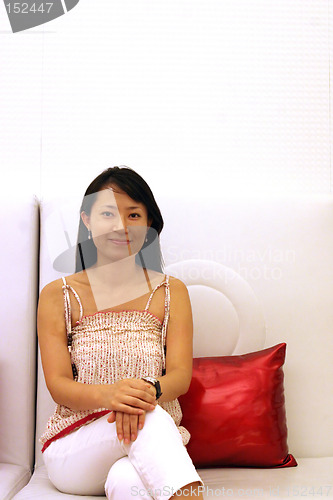 Image of Korean woman on a white couch