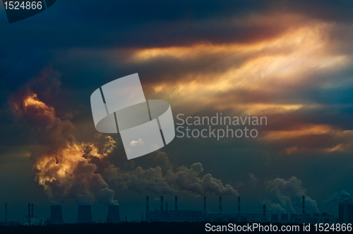 Image of Urban scene. Rays of light in sunset sky