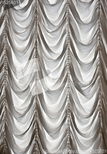Image of White curtains draped theater