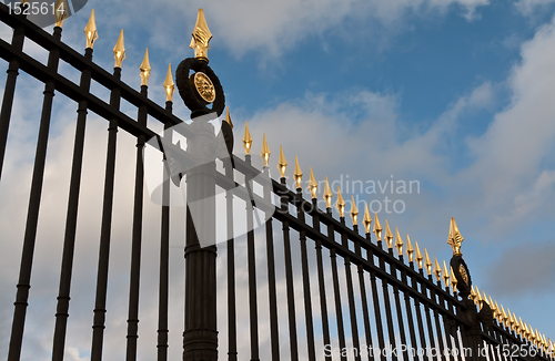 Image of steel fence with gold spears