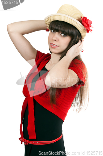 Image of Portrait of brunette girl in a hat with a flower and a red sweat