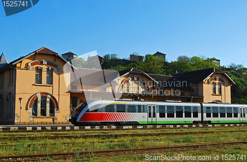 Image of Old railway station, modern train