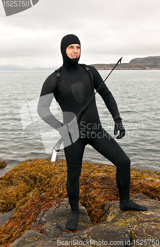 Image of Freediver in a diving suit on the Barents Sea