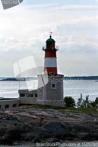 Image of lonely lighthouse on a rock