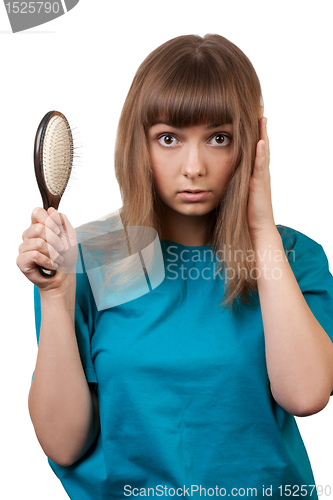 Image of young beautiful girl is combed