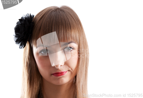Image of Portrait of the young girl with black rose in hair