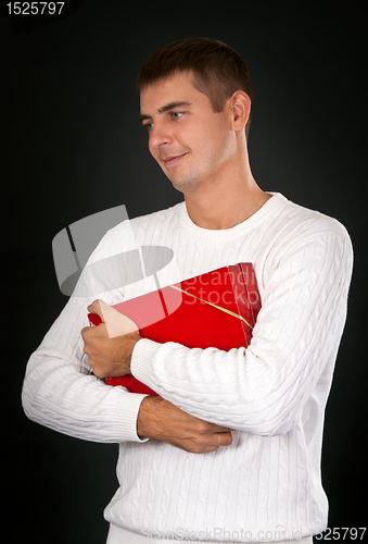 Image of sad man with a red gift box in a studio