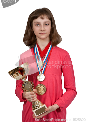 Image of Girl with gold medals and a cup