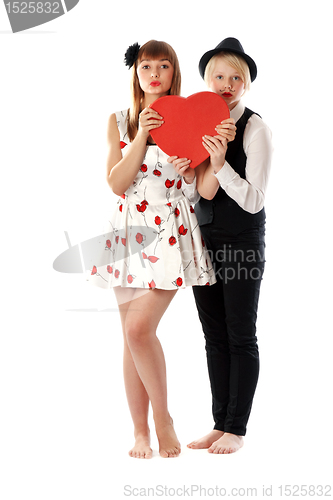 Image of Two girls with red cardboard heart