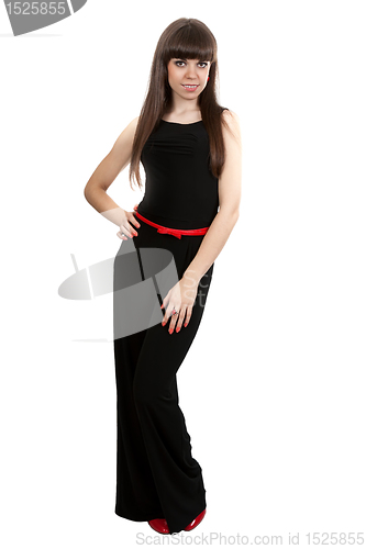 Image of girl in black pants and red shoes in the studio