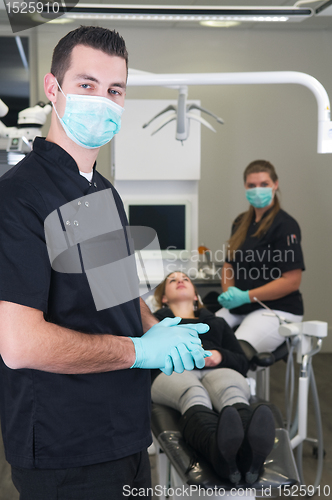 Image of Dentist with nurse and patient