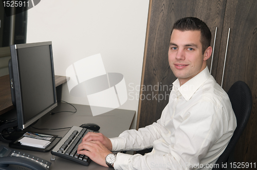 Image of Male worker at a helpdesk