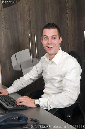 Image of Male worker at a helpdesk