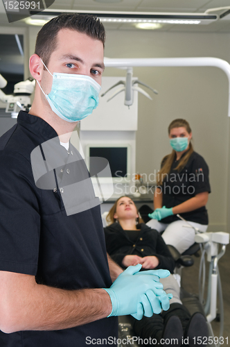 Image of Dentist with nurse and patient