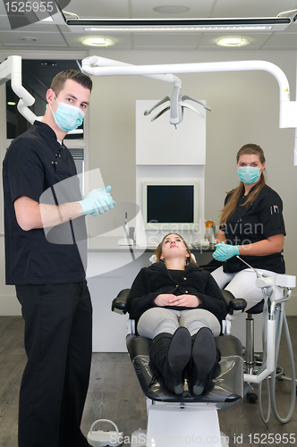 Image of Dentist with nurse and patient