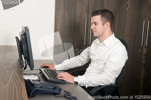 Image of Male worker at a helpdesk