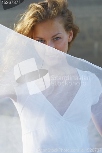 Image of Young woman with white scarf