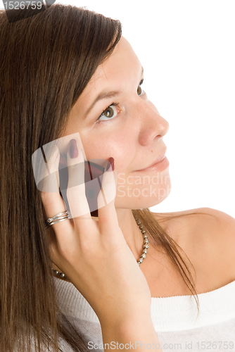 Image of Pretty woman talking by mobile phone