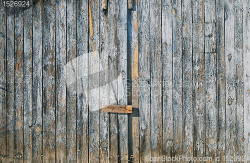 Image of Old faded blue wooden fence door