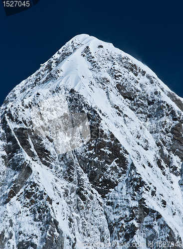 Image of Himalayas: Pumori peak and blue sky