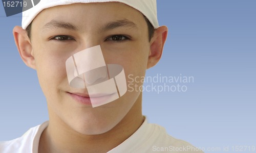 Image of Boy in a white hat isolated on blue