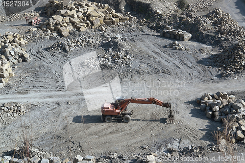 Image of resting quarry digger and stones