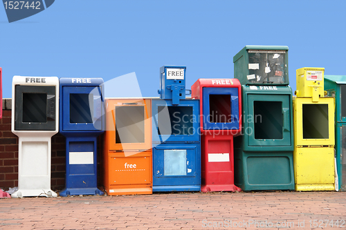 Image of various news racks in a row