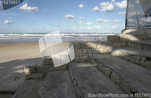 Image of shady stairs and sunny beach