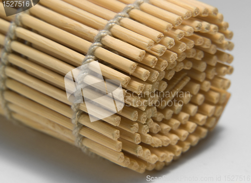 Image of rolled wooden mat detail