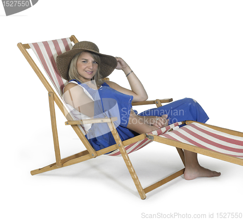 Image of cute relaxing girl in a canvas chair