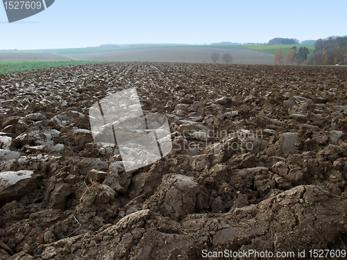 Image of plowed field in rural ambiance