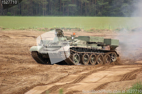 Image of offroad scenery with driving tank