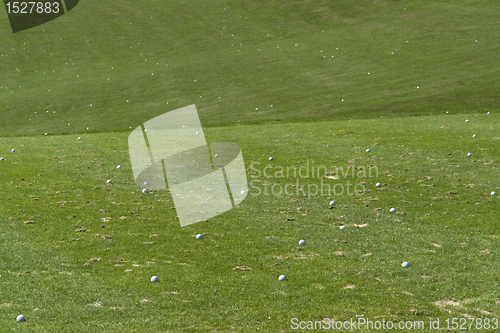 Image of golf balls and green