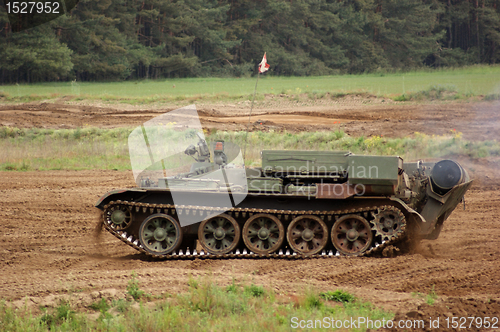 Image of offroad scenery with driving tank