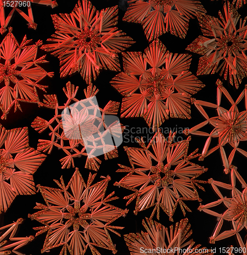 Image of red illuminated straw star ornament