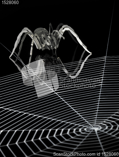 Image of metal spider and spiderweb