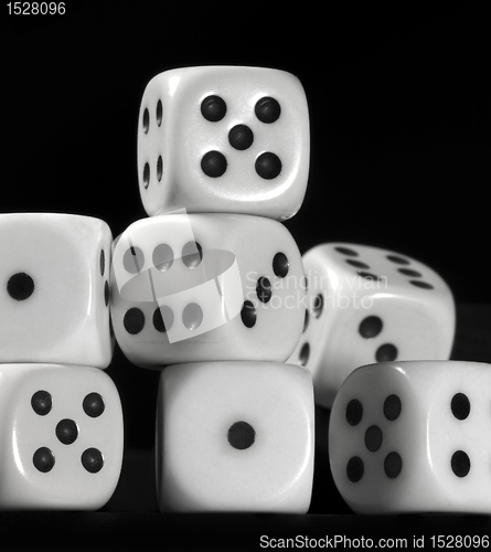 Image of white dice in black back