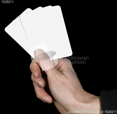 Image of hand and spread cards